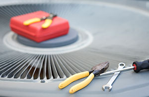 Tools on top of an AC unit